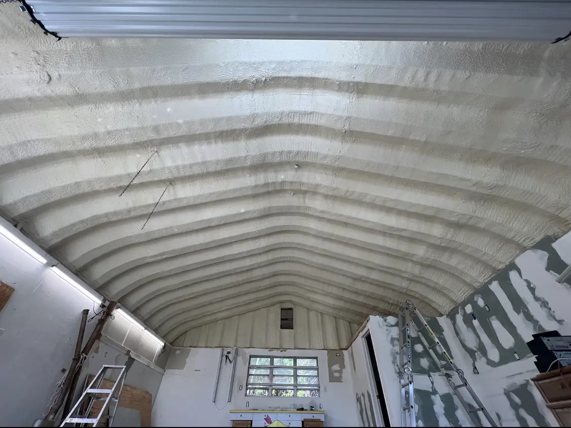Spray polyurethane foam applied to the underside of a metal roof deck in Alameda